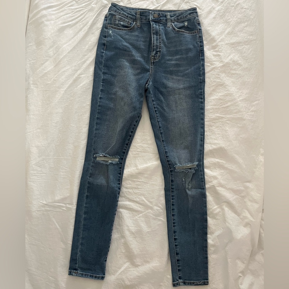 Medium wash distressed skinny jeans